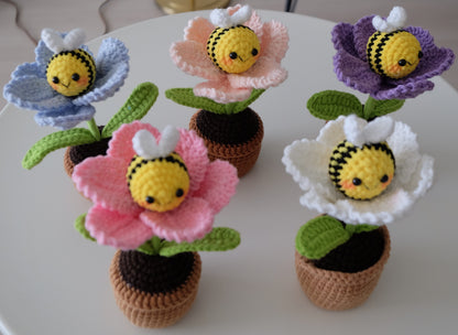 Handmade crochet potted plant features a beautiful blossom