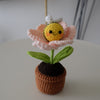 Handmade crochet potted plant features a beautiful blossom