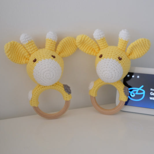 Handmade crochet rattle with a wooden ring base