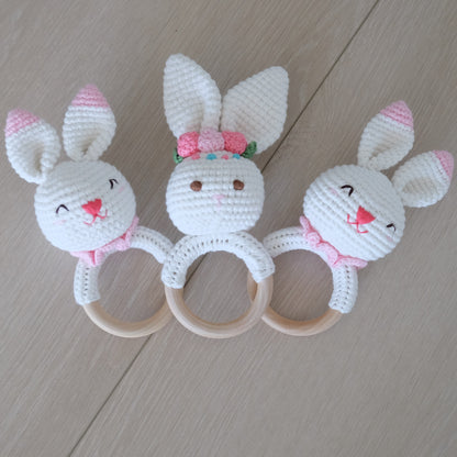 Handmade crochet rattle with a wooden ring base
