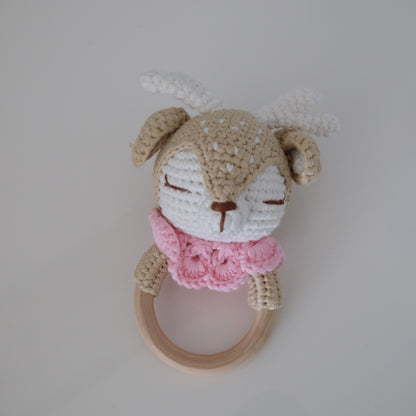 Handmade crochet rattle with a wooden ring base