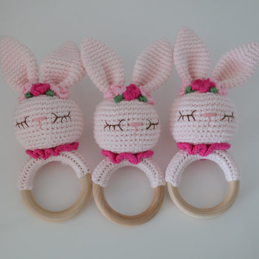 Handmade crochet rattle with a wooden ring base