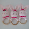 Handmade crochet rattle with a wooden ring base