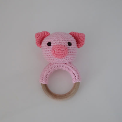 Handmade crochet rattle with a wooden ring base