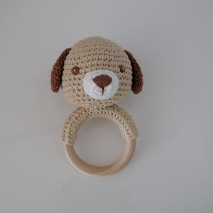 Handmade crochet rattle with a wooden ring base